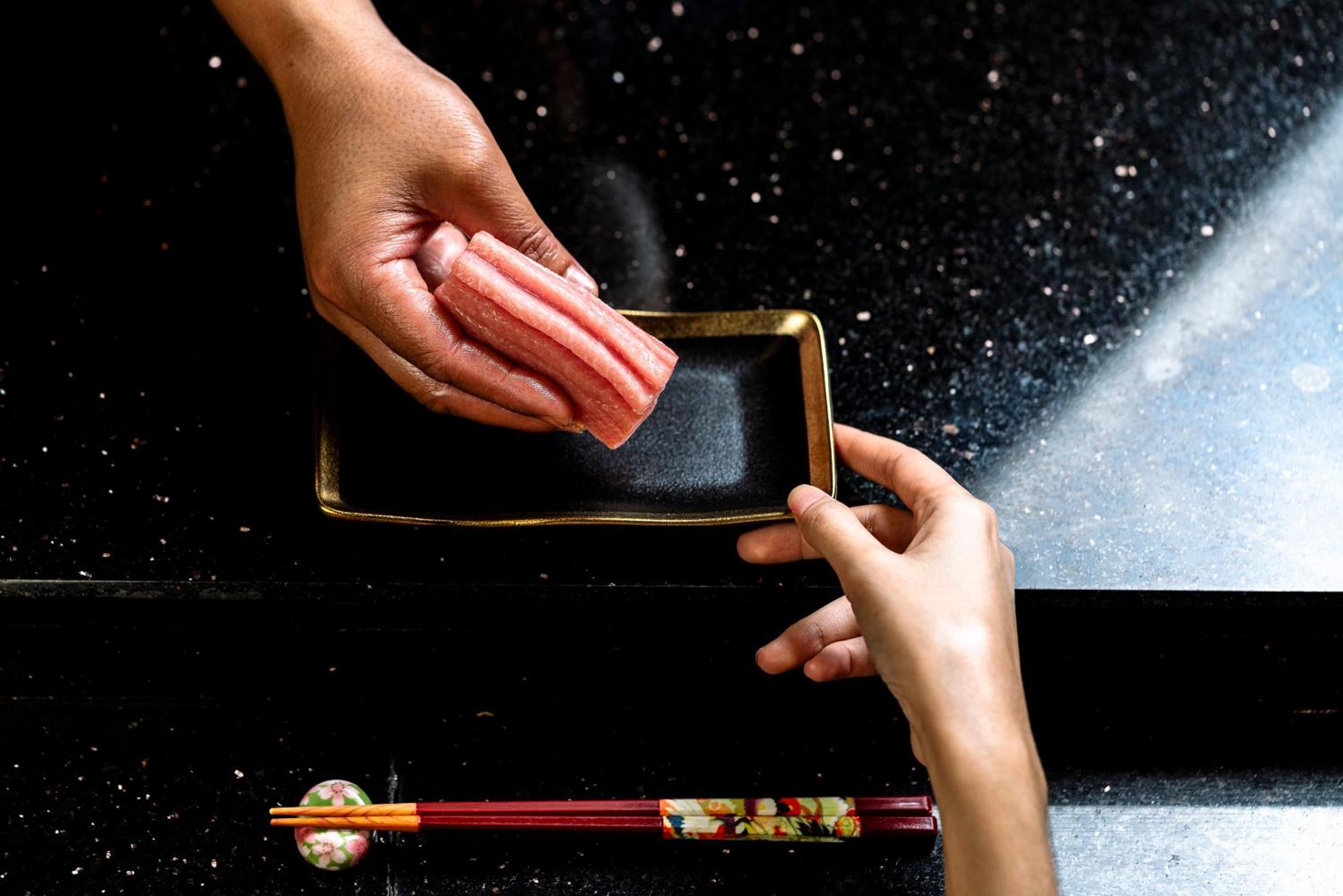Vie Hotel Bangkok - Mgallery Collection Exterior photo A sushi chef holding a rectangular plate